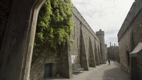 a pathway through a historical castle complex