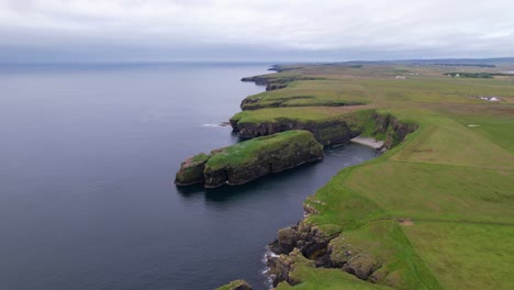 scotland's stunning cliffs by the sea, evoking calm and natural beauty, aerial view