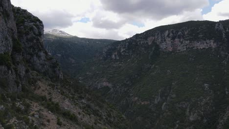 Aerial-View-of-Christian-Cross-on-Rock-Above-Qadisha-Valley,-Lebanon,-Drone-Shot