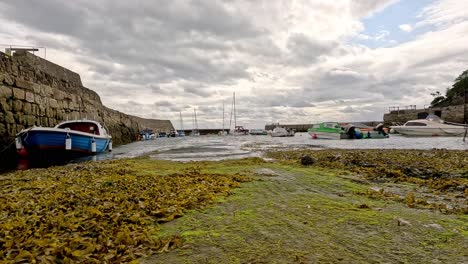 boat nearing pier in fife, scotland