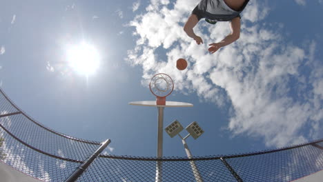 man playing basketball outdoors practicing and getting exercise fitness