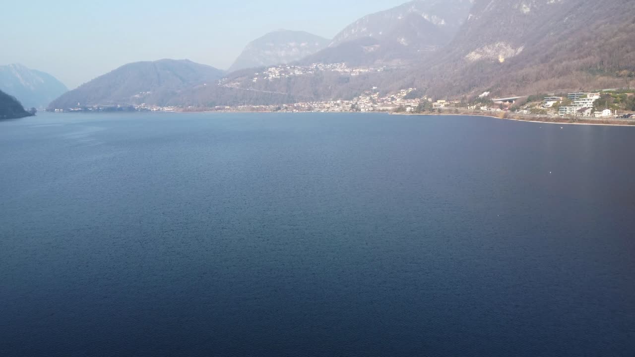shooting with drone of the clear waters of the lake of Capolago