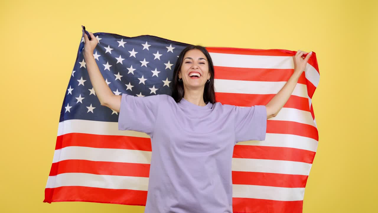 Happy woman waving the American flag