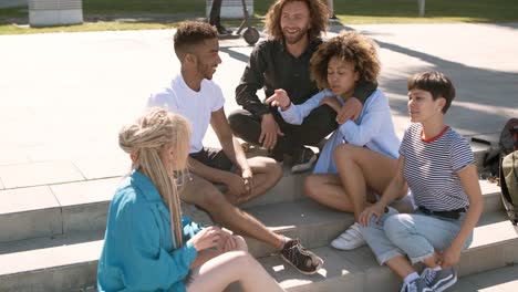 stylish friends chilling on street