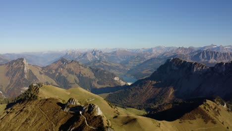 overflying mountain summits with autumn colors