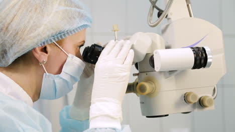operation of ophthalmology. surgeon hands in gloves performing laser eye vision correction