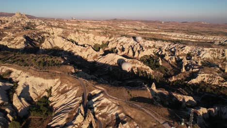 drone aerial view of picturesque landscape of cappadocia, turkey on sunny summer morning