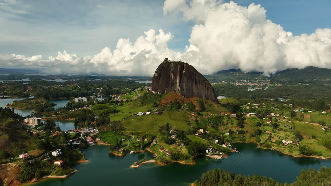 Aerial view over the reservoir, toward the El Pe&ntilde;&oacute;n monolith, in Guatape, Colombia