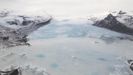 Glacier-tongue-of-Vatnajökull-Glacier,-Skaftafell-National-Park,-South-Iceland,-wide-aerial-panorama