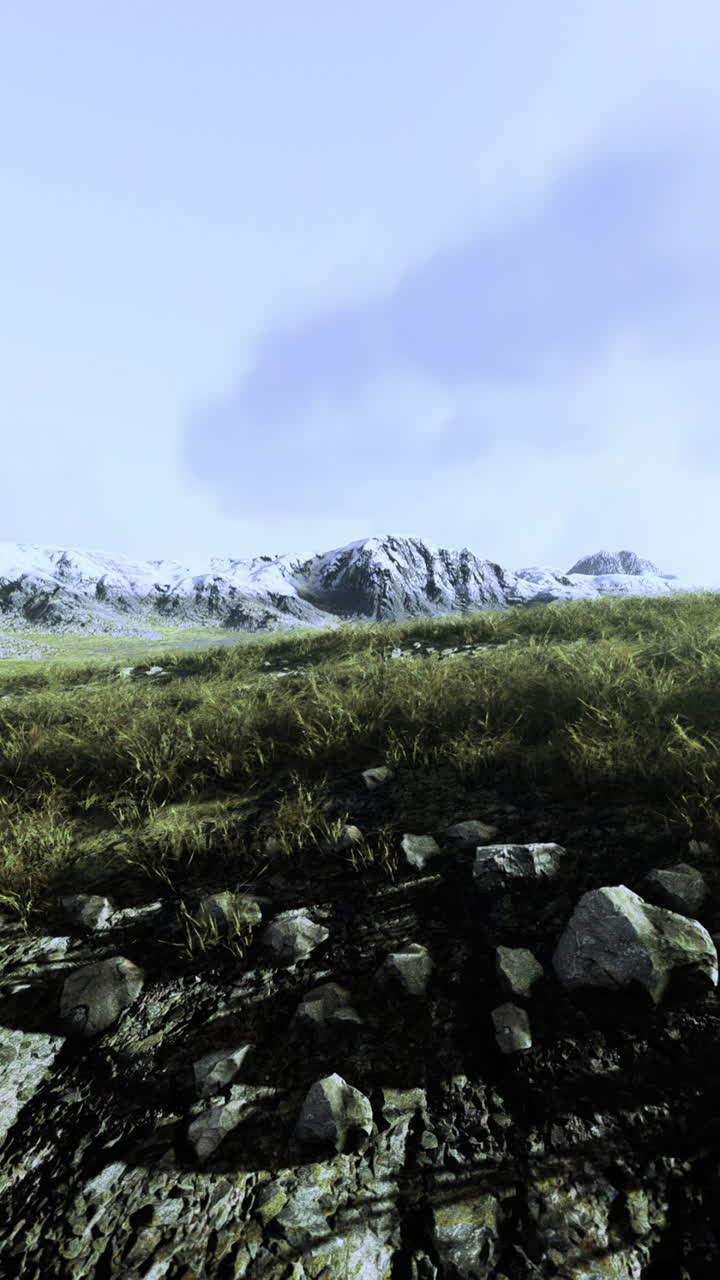 Rolling hills and rugged mountains create a serene backdrop lush green grass blankets the earth