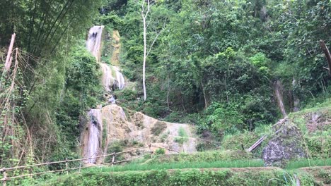 footage of beautiful waterfall in mountains at tropical island in asia