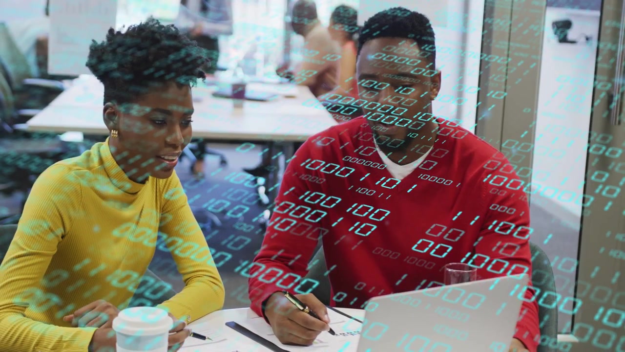 Binary overlay appearing, woman and man pointing at laptop, writing notebook, analyzing code