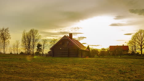 a timelapse footage of a barnyard on a sunset