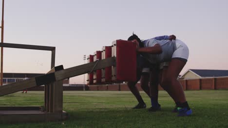 young adult female rugby players training