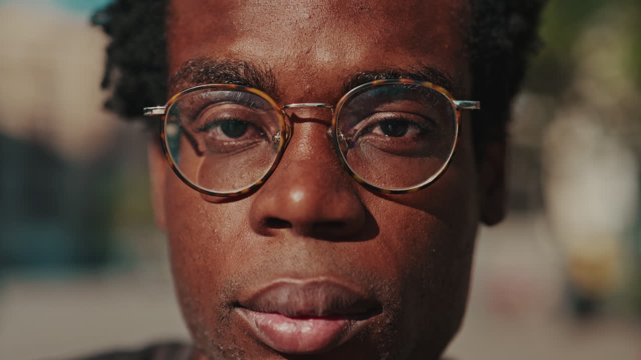 Close-up Portrait of a Young African American Man in Glasses