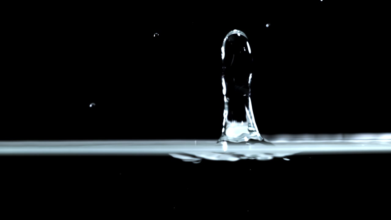 Slow Motion Water Drop Splashing on Black Background