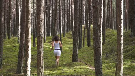 girl playing hide and seek in the forest