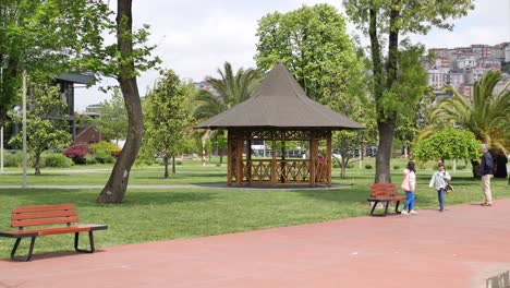 park scene with gazebo and people