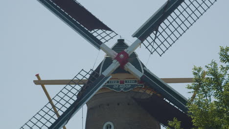 Close-up-of-old-Dutch-windmill-wing-cross-spinning
