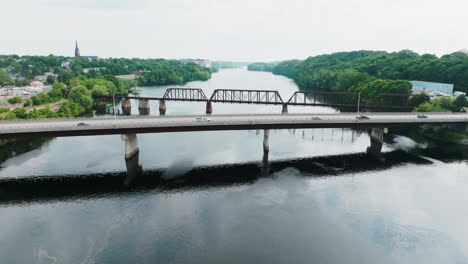 aerial view unfolds the scene of bangor, brewer, and the bridge-spanned penobscot river in maine