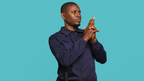 guardian prepared to handle security breaches, doing pistol fingers gesturing