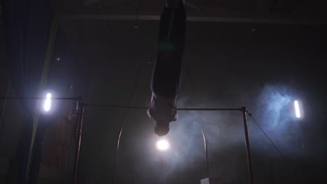 Gymnast-exercises-on-high-horizontal-bar-HD-slow-motion-video.-Athlete-training-gymnastics-skills-and-performing-giant-elements