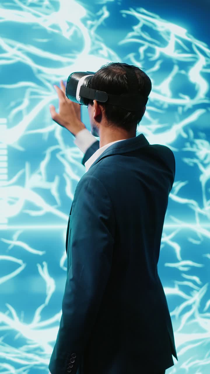 Vertical video Computer scientist wearing VR headset interacting with AI visualization