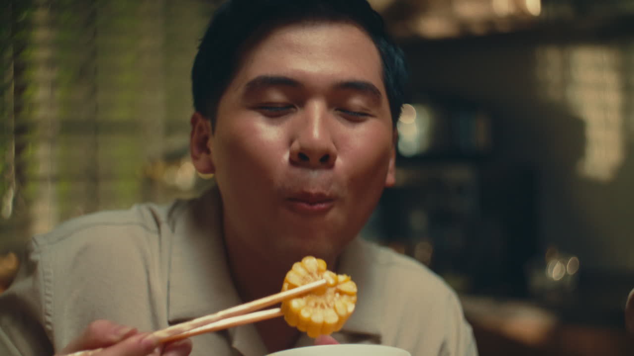 Man Eating Rice with Chopsticks