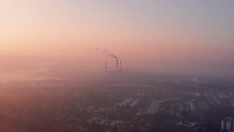 Orange foggy sunrise over Warsaw, Poland. Smog reduces visibility