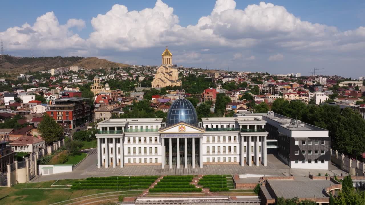 Fixed Aerial View Above State Palace of Ceremonies. Holy Trinity Cathedral of Tbilisi in Background