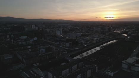 guinness factory during breathtaking sunset - 4k cinematic drone shot - dublin - ireland