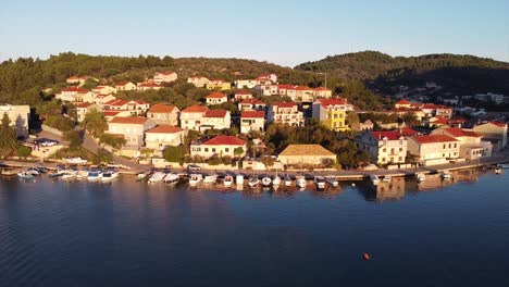 croatia island drone footage over housing area in the sunlight as drone descends down