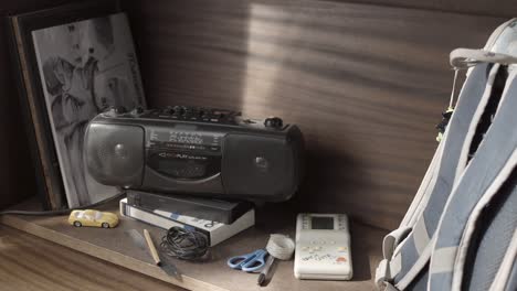 shelf with vintage electronics and accessories