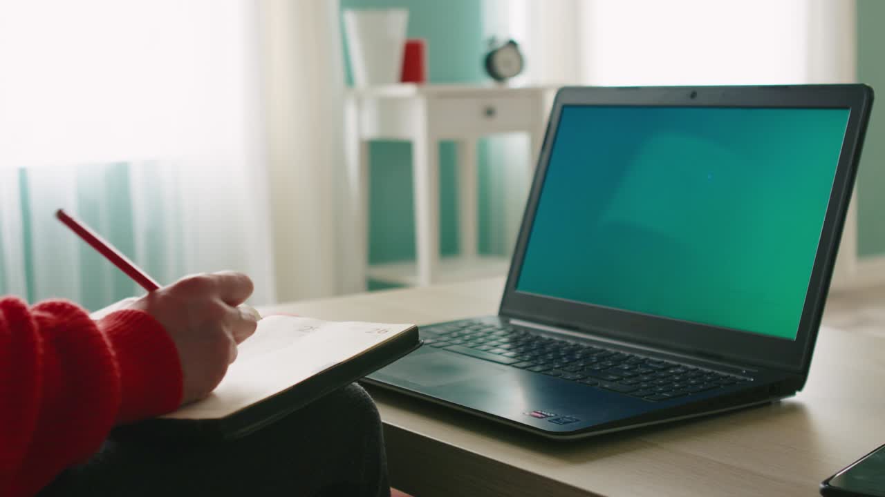Woman Uses Laptop with Chroma Key to Have Online Meeting