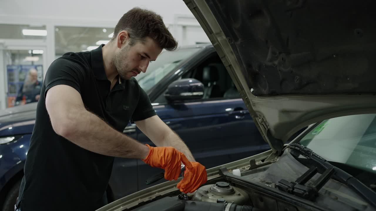 Car Mechanic Repairing Car Engine