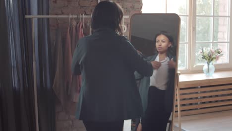 businesswoman dressing at home