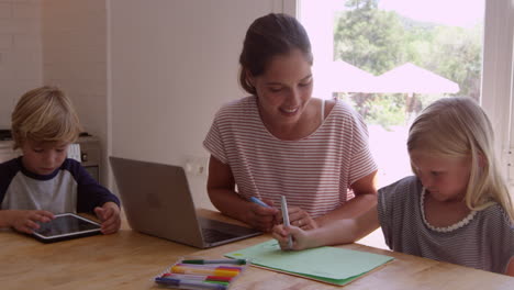 mum and two kids working at the kitchen table, shot on r3d