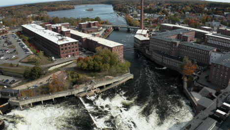 Drone-shot-of-Saco-River-and-old-mills-in-Biddeford,-Maine