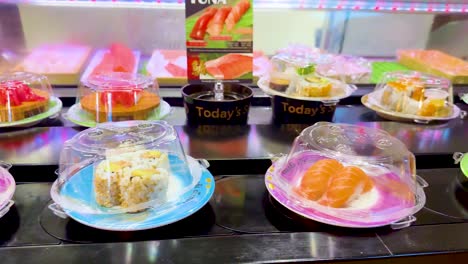 sushi dishes moving on a conveyor belt