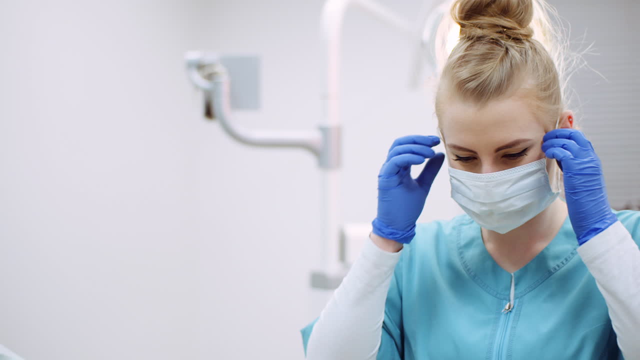 Dentist Putting On Protective Mask Before Surgery