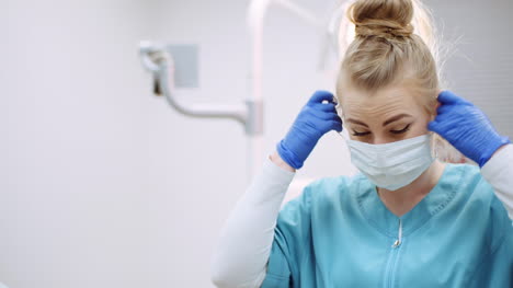 dentist putting on protective mask before surgery