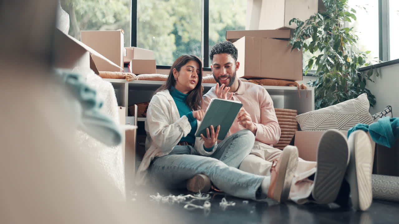 Couple Planning Move in New Home with Tablet