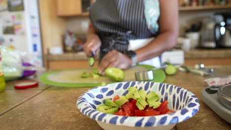 dicing fresh, organic avocado for a chopped salad - antipasto salad series