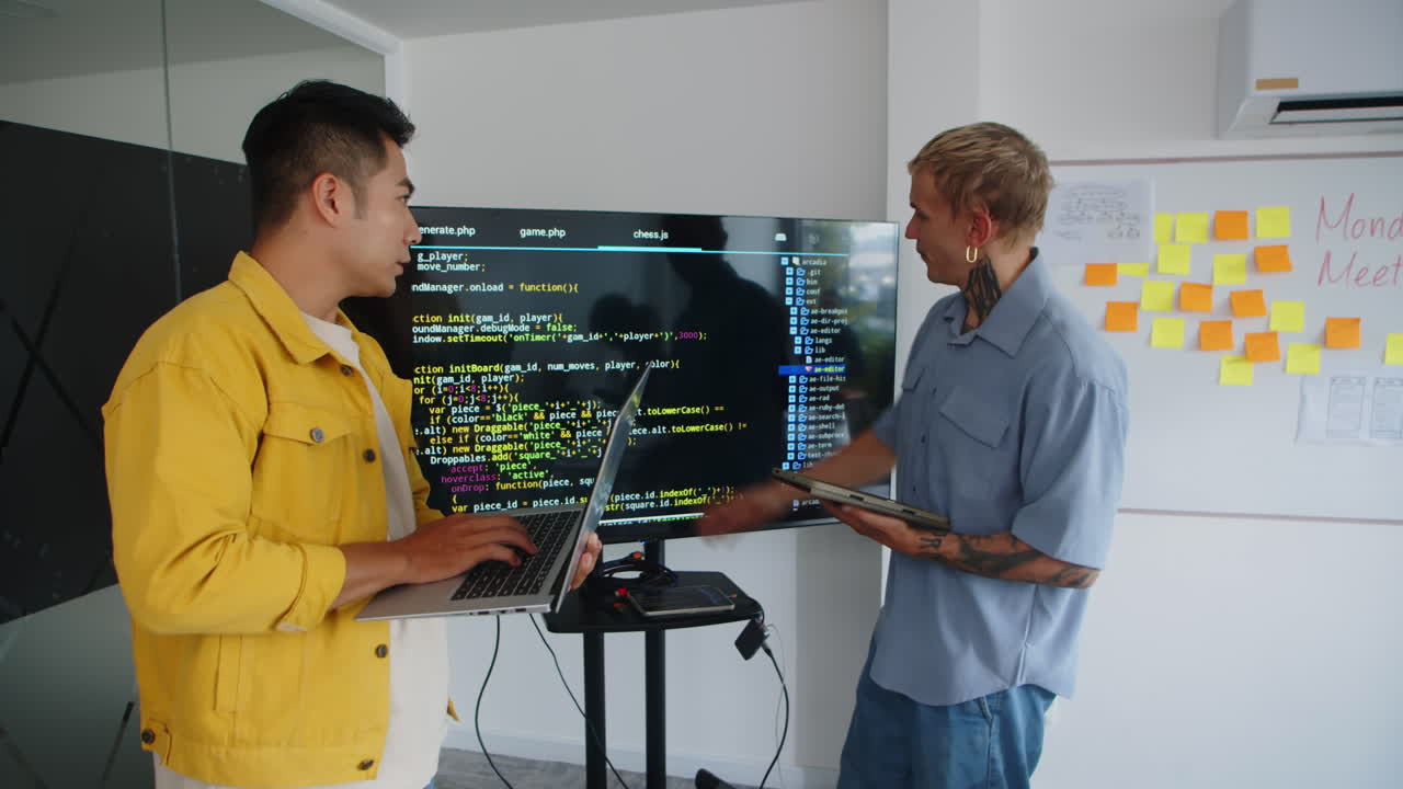 Developers Testing Script on Screen on Monitor