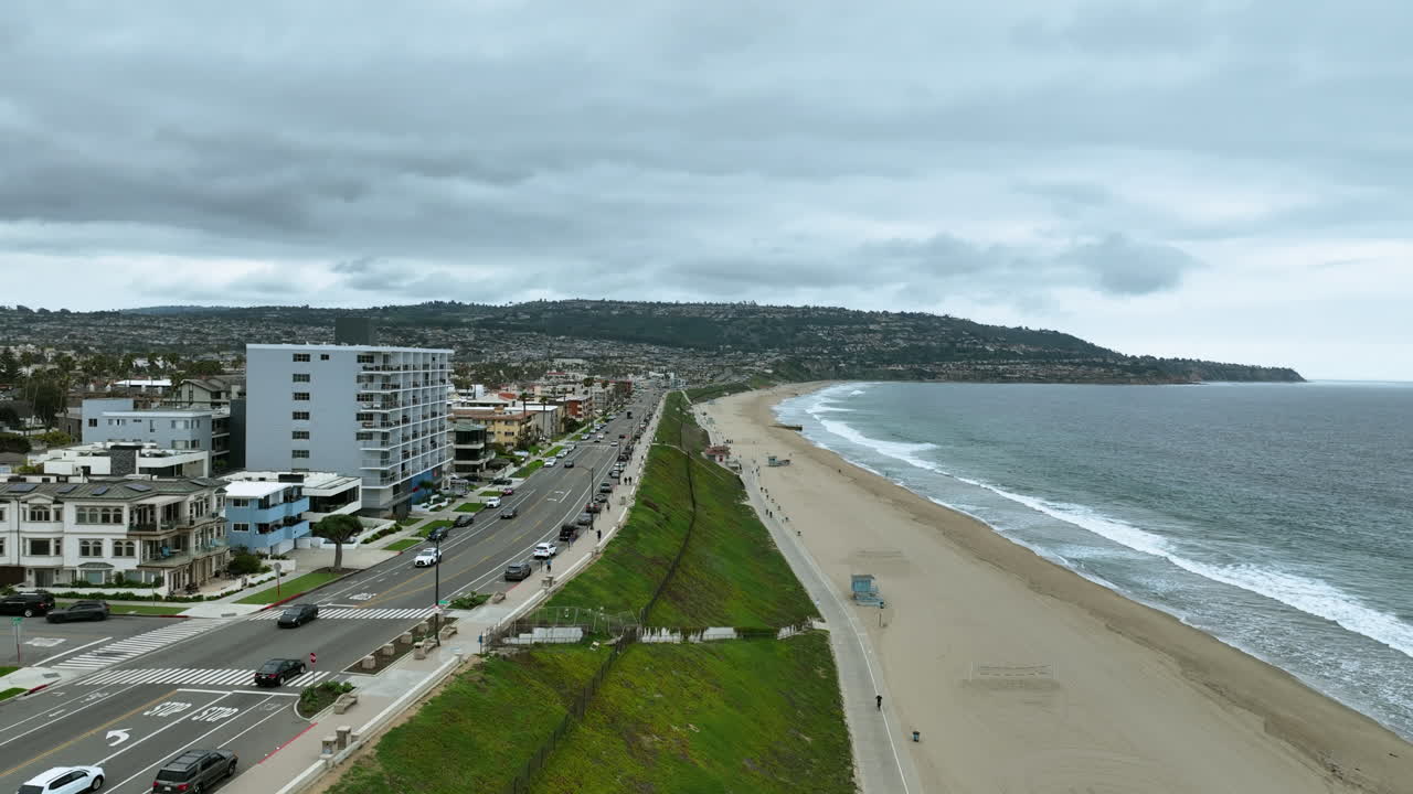 Aerial view of the Rendondo beach, dark, cloudy day in Los Angeles, USA