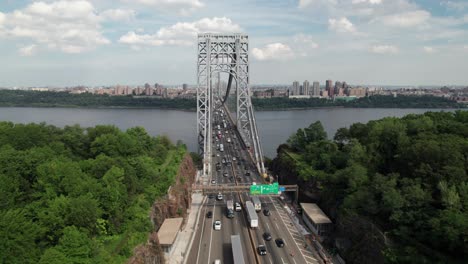 cool aerial of bridge traffic in nyc, hudson river, 4k