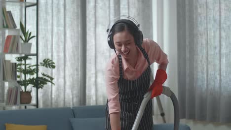 woman cleaning while dancing to music