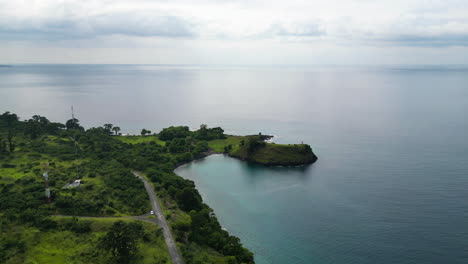 aerial view of a falcon harrasing a drone on the coast of sao tome and principe