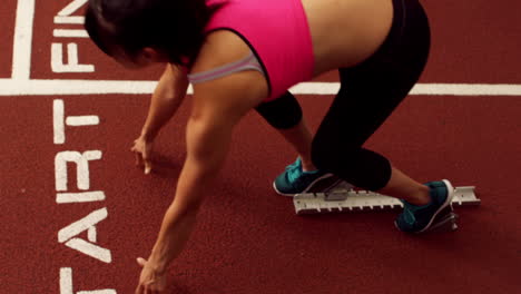 fit woman at starting point