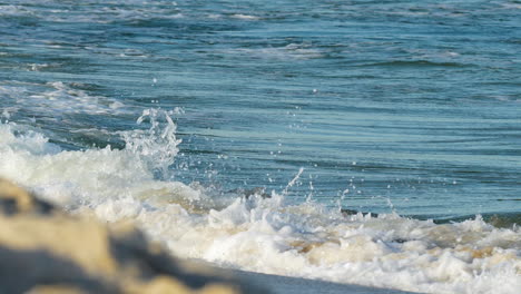 Foamy ocean waves approaching the shore, a dynamic display of sea&#039;s perpetual motion